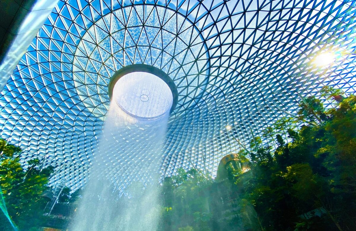 The Ultimate Guide to Free Stopovers: Experience iconic sights like the indoor waterfall at Singapore's Jewel Changi Airport during your layover